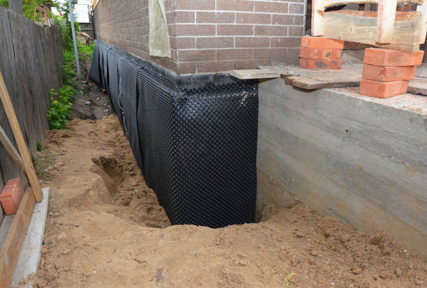 Happy homeowners after waterproofing job in Triangle